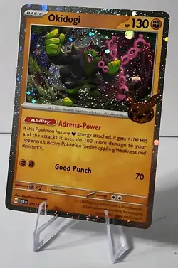 Pokemon TCG Cosmos Holo Okidogi 111/167 Trick Or Trade Part Swirl NM - Image 1