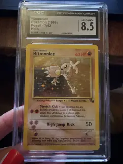 CGC 8.5 Hitmonlee 1999 Fossil 7/62 Holo Pokemon Card - Image 1
