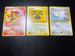[US Duty Inc] Moltres Zapdos ANA Nippon Airways No. 144 Japanese Pokemon Card - Image 1