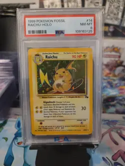 Pokemon TCG Raichu Fossil Holo Card 14/62 Unlimited Holo Rare PSA 8 - Image 1
