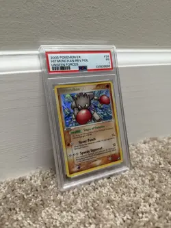 PSA 1 Hitmonchan Unseen Forces Reverse Holo Rare Pokemon Card - Image 1