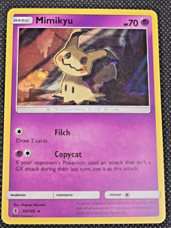 Mimikyu 58/145 SM-Guardians Rising Holo LP/NM Pokemon Card L11 - Image 1