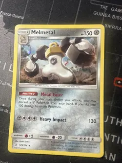 Pokemon COSMO RARE HOLO MELMETAL 129/214 Sun & Moon Unbroken Bonds NM/Mint - Image 1