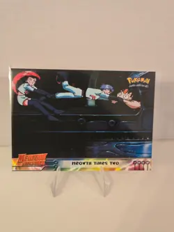 1999 Topps Pokemon: The First Movie 23 Meowth Times Two Blue Logo First Edition - Image 1