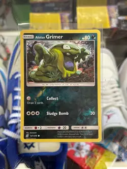Pokemon Alolan Grimer 127/236 Reverse Holo Card Unified Minds SET COLLECT RARE - Image 1