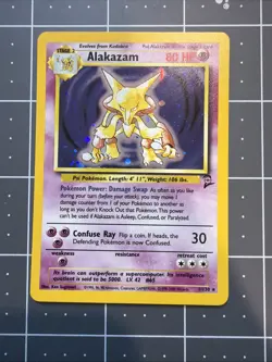 Alakazam Holo 1/130 Rare Base Set 2 WOTC Pokemon TCG Card, Near Mint Condition - Image 1