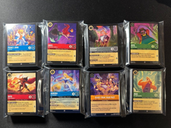 35x Disney Lorcana Lot - Guaranteed 3 Super Rare/Rare and 2 Cold Foil NM Cards - Image 1