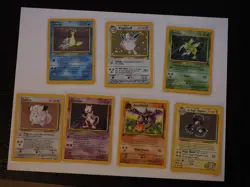 Assorted Pokemon Cards from Base Set, Jungle, Fossil, Base 2, and Gym Heroes - Image 1