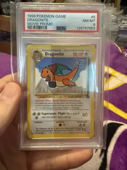 1999 POKEMON GAME MOVIE MOVIE PROMO #5 DRAGONITE PSA 8 - Image 1