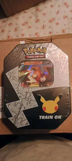 Pokemon TCG Lance’s Charizard V Celebration Tin. 25th Anniversary Factory Sealed - Image 1
