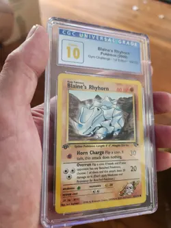 (POP 7) CGC 10 1st Edition Blaine’s Rhyhorn 65/132 Gym Challenge Pokemon Card - Image 1