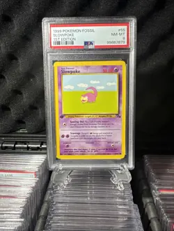 1999 POKEMON FOSSIL #55 SLOWPOKE 1ST EDITION PSA 8 - Image 1