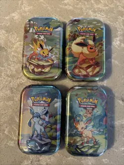 Lot of 4 Pokemon TCG Prismatic Evolutions Mini Tins NEW SEALED - Image 1