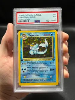 PSA 7 NM Vaporeon Holo 12/64 1st Edition Jungle 1999 Pokemon Card Vintage WOTC - Image 1