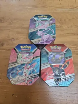 Pokemon TCG V HEROES Tins Set of 3 Espeon, Sylveon, And Umbreon - Image 1