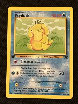 Psyduck 65/82 1st Edition Team Rocket Regular NM (Nice Card) - Image 1