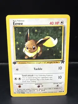 Pokemon TCG Team Rocket 1st Edition Regular Finish Eevee 55/82 E - Image 1