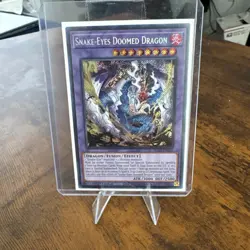 Snake-Eyes Doomed Dragon Secret Rare SUDA-EN035 Near Mint 1st Ed Yu-Gi-Oh! - Image 1