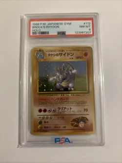 PSA 8 Brock's Rhydon 1998 Gym Heroes Japanese 112 Holo Pokemon Card With Swirl - Image 1