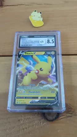 Pokemon TCG Pikachu V 061 2021 with Pin CGC 8.5 Graded + Enamel Pin - Image 1