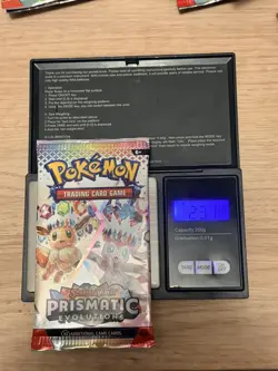 Pokemon TCG Prismatic Evolutions Booster Pack Heavy (23.19g) - BRAND NEW/ SEALED - Image 1