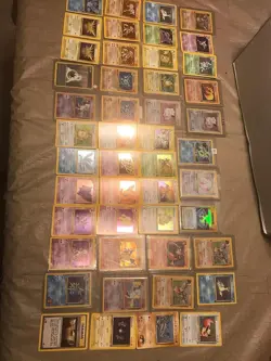 Exclusive 1999 Pokemon Card Collection: 50 Unique Cards + Holographic Guarantee - Image 1