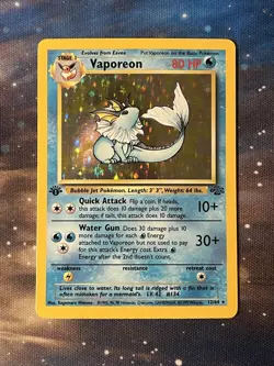 1999 POKEMON VAPOREON 1ST EDITION JUNGLE 12/64 HOLO RARE NM - Image 1