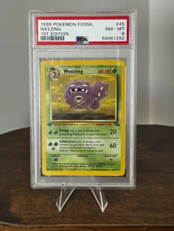 1999 Pokemon 1st Edition Fossil Weezing 45/62 PSA 8 Near Mint-Mint - Image 1
