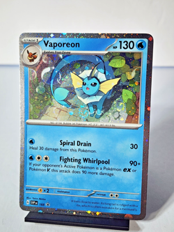 🌀Vaporeon (Cosmos Holo) SVP 168 - Scarlet & Violet Promo Card - DOUBLE SWIRL🌀 - Image 1