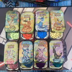 Pokemon Prismatic Evolution All 8 Mini-Tins - Tins and Coins Only (No Packs) - Image 1