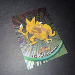 Pokemon Topps TV Animation Series 1 (Black Logo) #64 Kadabra Silver Holo (Rays) - Image 1