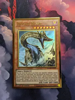 YuGiOh Danger! Nessie! Gold Rare 1st Edition MGED-EN019 NM - Image 1