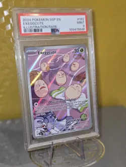 2024 POKEMON SSP EN-SURGING SPARKS ILLUSTRATION RARE #192 EXEGGCUTE PSA 9 MINT - Image 1