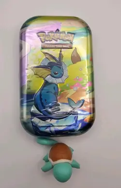Pokemon TCG Prismatic Evolutions Mini Tin Vaporeon Factory Sealed - Image 1