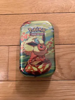 Pokemon TCG Scarlet & Violet Prismatic Evolutions Mini Tin Sealed (Flareon) - Image 1