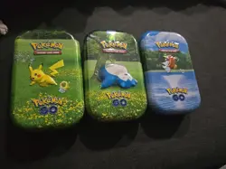 3 POKEMON GO MINI TIN NO CARDS COMES WITH COINS AND A COUPLE OF STICKERS - Image 1