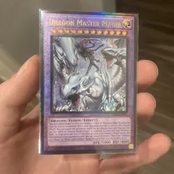 DRAGON MASTER MAGIA - 1ST EDITION PRISMATIC ULTIMATE RARE RA04-EN055 YUGIOH - Image 1