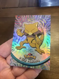 1999 Topps Pokemon TV Animation #63 Abra Rainbow Foil Black Logo - Image 3