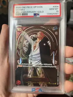 2025 ONE PIECE OP13-CARRYING ON HIS WILL 3RD ANV-GOLD #004 SHANKS PSA 10 - Image 1