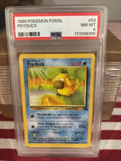 1999 POKEMON FOSSIL #53 PSYDUCK PSA 8 - Image 1