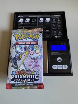 Pokemon Prismatic Evolutions Booster Pack -HEAVY 24.30g- Possible Demi/God Pack! - Image 1