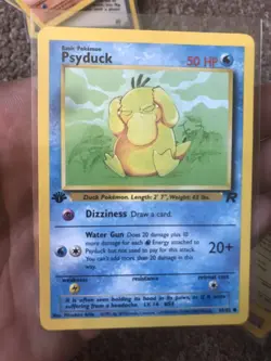 Psyduck 65/82 1st Edition NM Near Mint Team Rocket Non-Holo Pokemon Card - Image 1