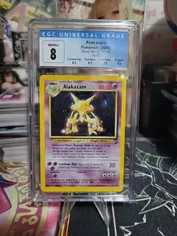 Alakazam Base Set 2 Holo Rare 1/130 CGC 8 Pokemon Card 2000 Ken Sugimori - Image 1