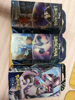 Two Disney Lorcana Rise of the Floodborn Decks & Pokemon GO Mewtwo V Deck - Image 1