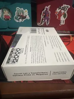MTG Secret Lair x Transformers: Optimus Prime vs. Megatron FOIL (Sealed) - Image 2