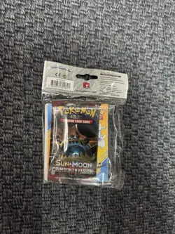 Pokemon Sun and Moon Crimson Invasion collectors album and booster pack - Image 1