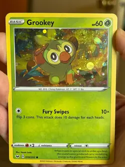 POKEMON GROOKEY 010/202 COMMON COSMOS HOLOFOIL WITH SWIRL SWORD & SHIELD NM CARD - Image 1