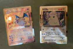 pair of Pokemon Celebrations Charizard And Pikachu Metal Cards, protective cases - Image 1