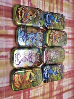 Pokemon Scarlet & Violet: Prismatic Evolutions Sealed Mini Tin (EMPTY) X8 - Image 1