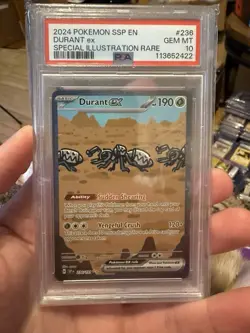2024 POKEMON SSP EN-SURGING SPARKS SPECIAL ILLUSTRATION RARE DURANT EX PSA 10 - Image 1